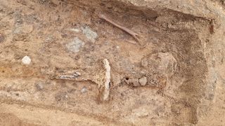 Excavated sword in a gravesite.