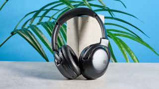 the JBL Tour One M2 headphones with black cups and a black exterior with bluetooth and 2.5mm jack connections