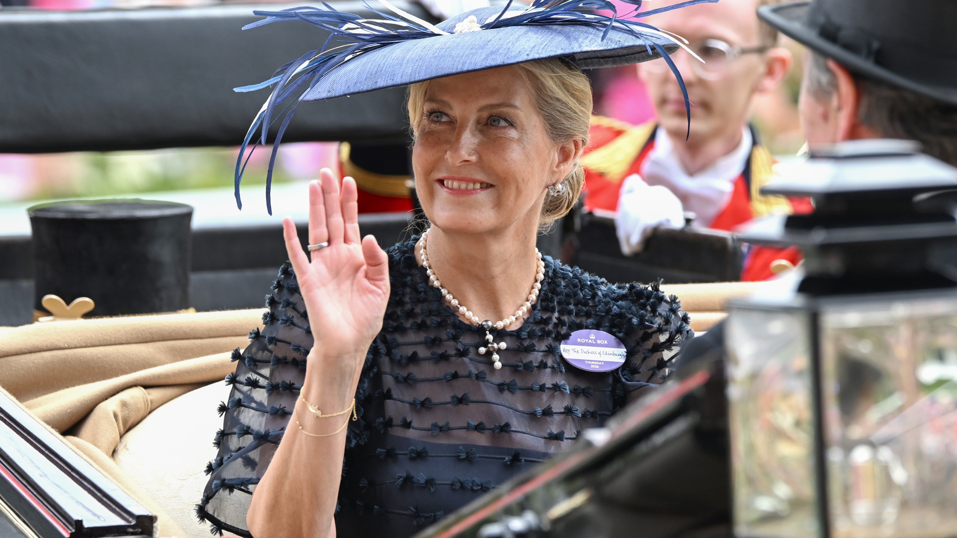 Sophie, Duchess of Edinburgh smiles and waves as she attends day three of Royal Ascot 2026