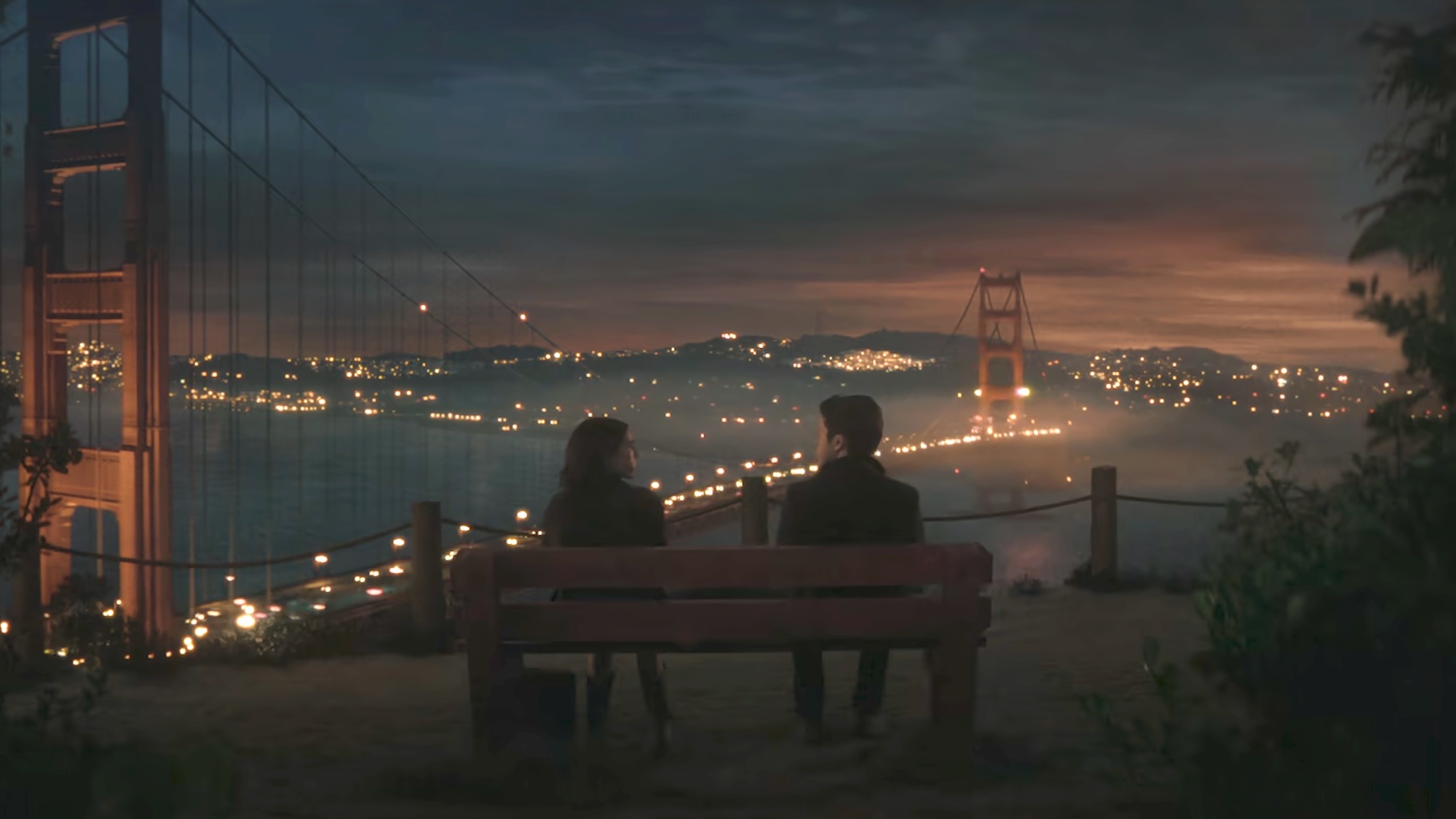 Jill and Wes (from behind) talking on a bench overlooking the Golden Gate Bridge