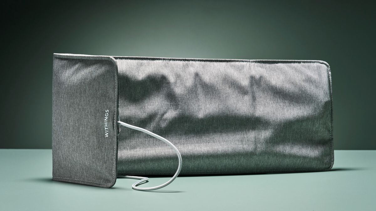 The grey Withings sleep tracking mat against turquoise background
