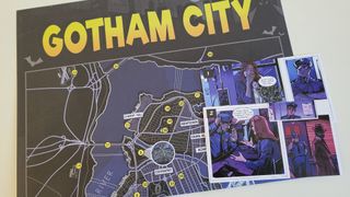 Batman: Everybody Lies map and comic book scene on a plain table