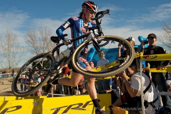 Katie Compton (Planet Bike) over the barriers.