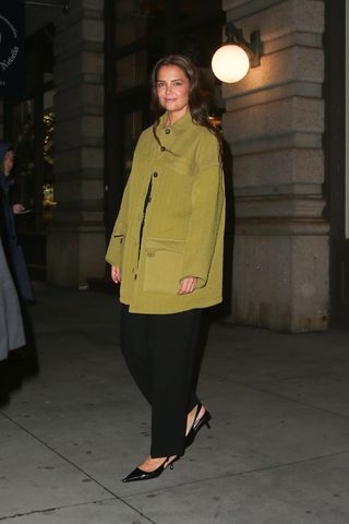 Katie Holmes wears an olive green Everlane utility jacket while dining in New York City