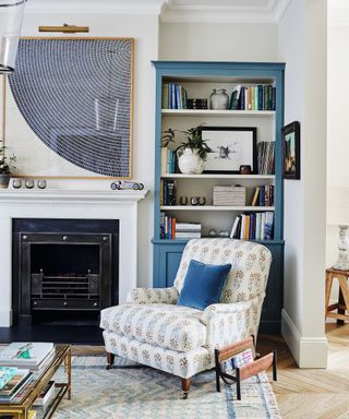 sitting room with armchair and bookshelf