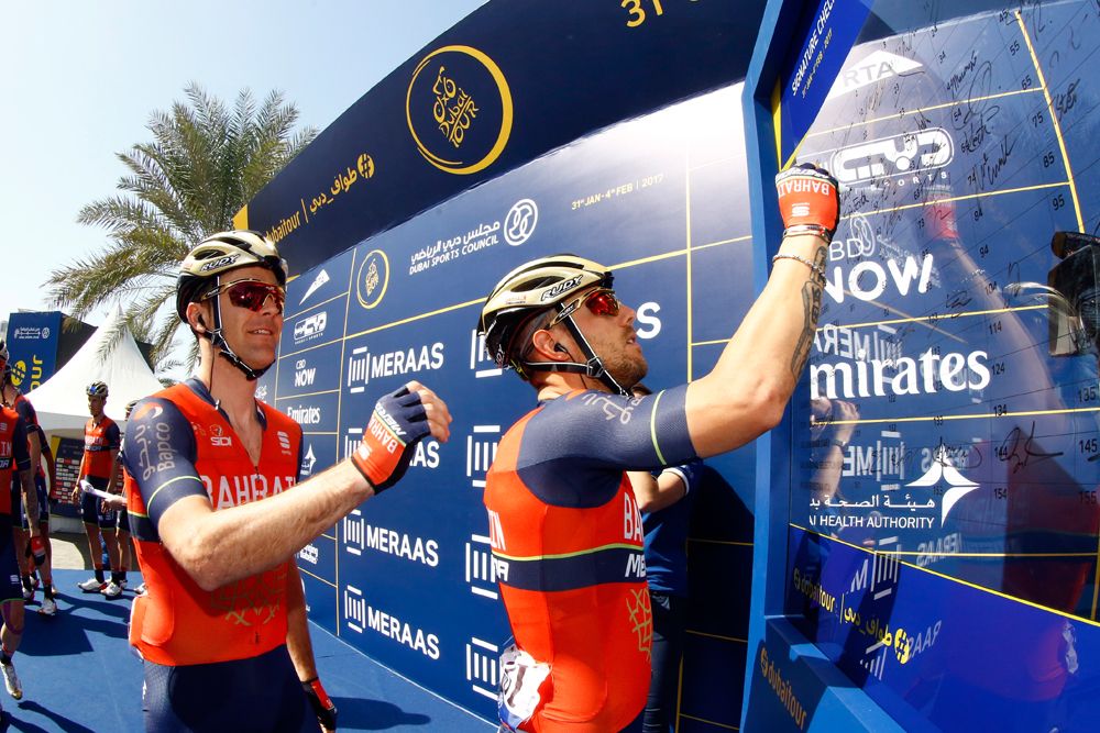 Bahrain Merida riders sign on at the start of stage 5