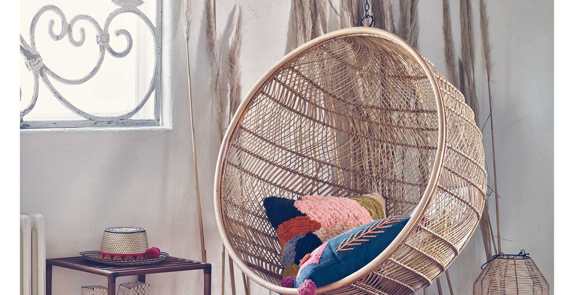 rattan hanging egg chair to show how to get the 70s inspired interior design trend for the modern home