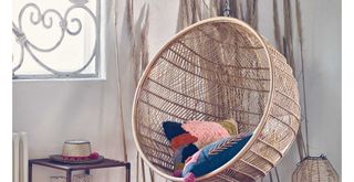 rattan hanging egg chair to show how to get the 70s inspired interior design trend for the modern home