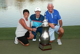 Rory McIlroy of Northern Ireland poses with his parents, Rose and Gerry McIlroy