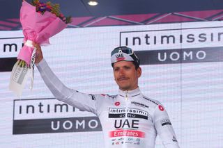 UAE Team Emiratess Portuguese rider Joao Almeida celebrates his best young riders white jersey on the podium after the nineteenth stage of the Giro dItalia 2023 cycling race 183 km between Longarone and Tre Cime di Lavaredo rifugio Auronzo on May 26 2023 Photo by Luca Bettini AFP Photo by LUCA BETTINIAFP via Getty Images