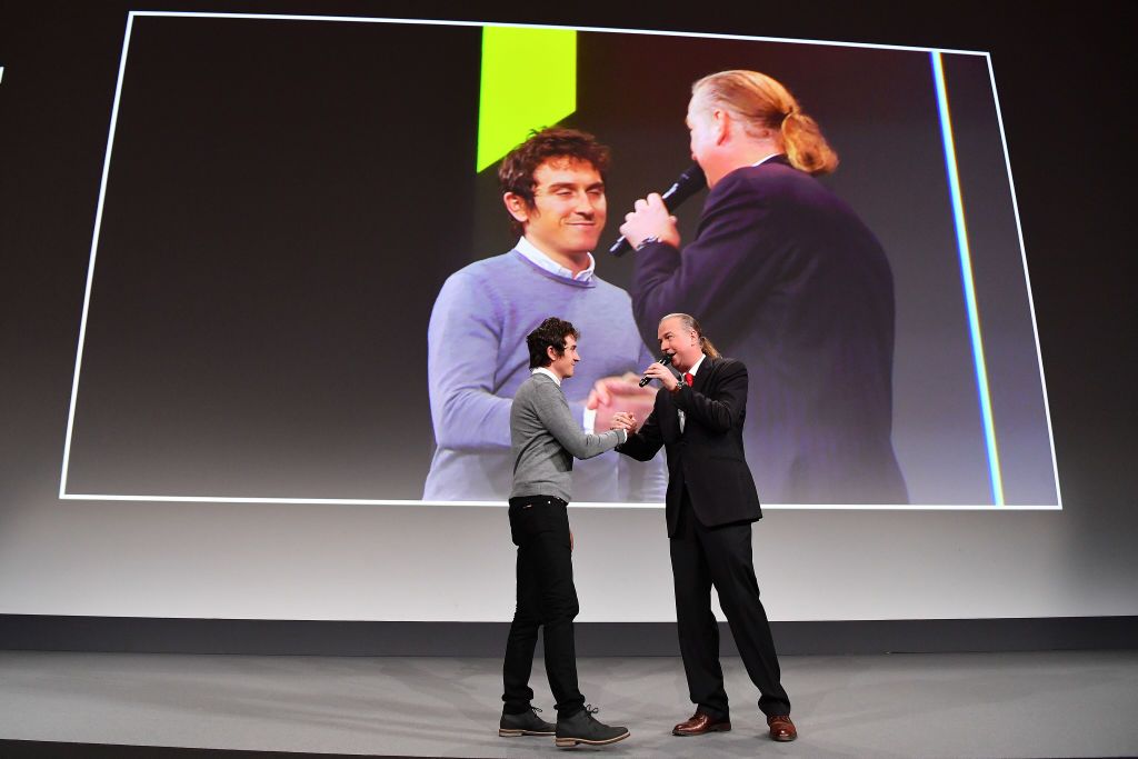 Tour de France champion Geraint Thomas walks onto the stage