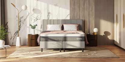 Emma mattress in pink and grey room with bedside table and grey headboard
