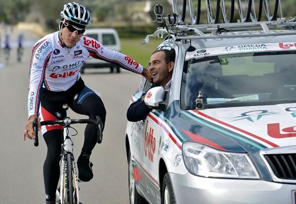 Philippe Gilbert has a chat with Marc Seargent at the team car.