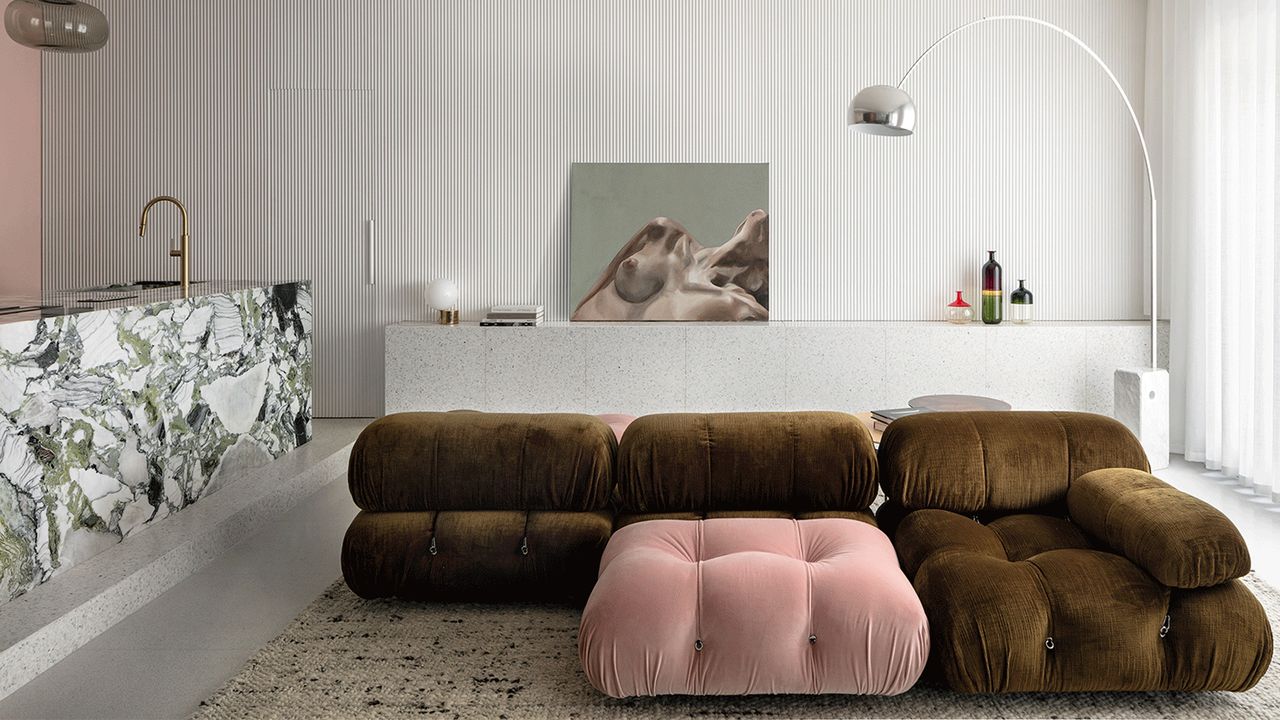 a white modern living rom with a green and pink camaleonda sofa