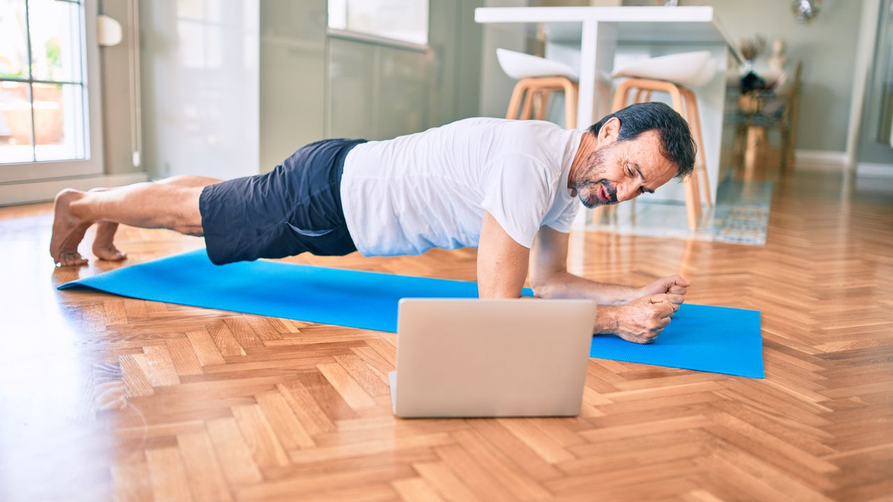 Man holding a plank