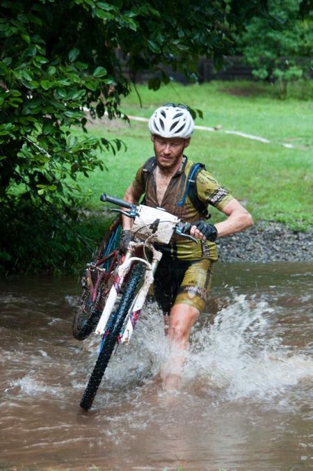 Ernesto Marenchin (Speedgoat) fords the swollen creek just before the finish