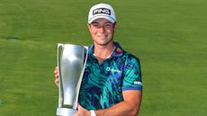 Viktor Hovland poses for a photo with the BMW Championship trophy