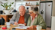 older couple saving