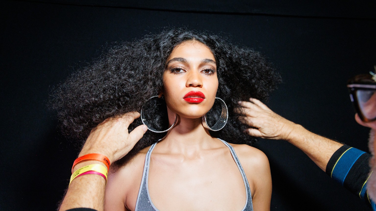 Woman with Curly Hair Getting It Styled