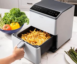 Cosori Blaze II Air Fryer on the countertop with fries in the basker