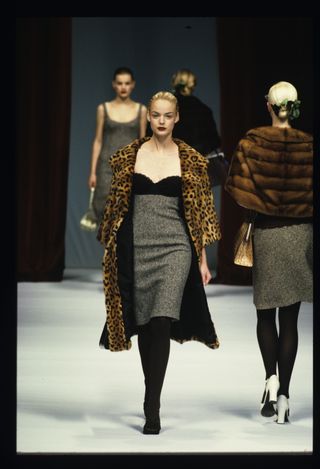 Calvin Klein model wearing leopard coat with grey dress