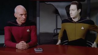 Picard and Data seated next to a Data Pad