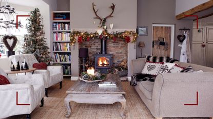 Neutral country living room with log burner in an open brick fireplace and two armchairs facing a beige linen sofa