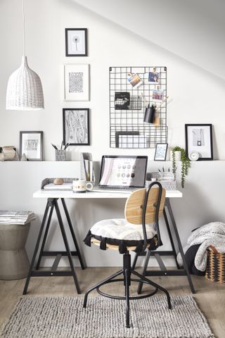 black and white home office with gallery wall