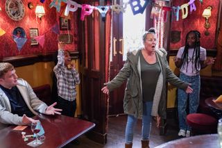 Karen Taylor is delighted by her surprise party