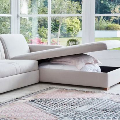L-shaped sofa with storage in conservatory