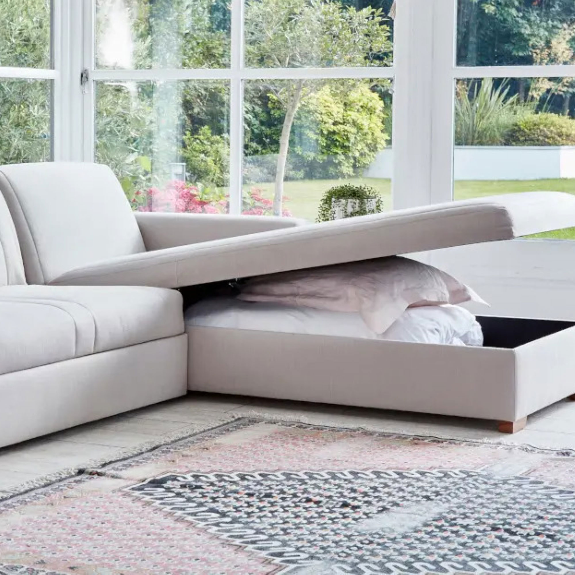 L-shaped sofa with storage in conservatory