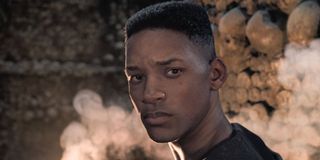 Gemini Man young Will Smith looks away from the fire in the catacombs