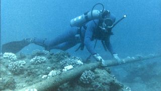 A SCUBA Diver Checks An Undersea Cable