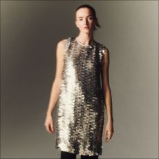 A model wears a silver sequin slip dress by Lafayette 148 New York