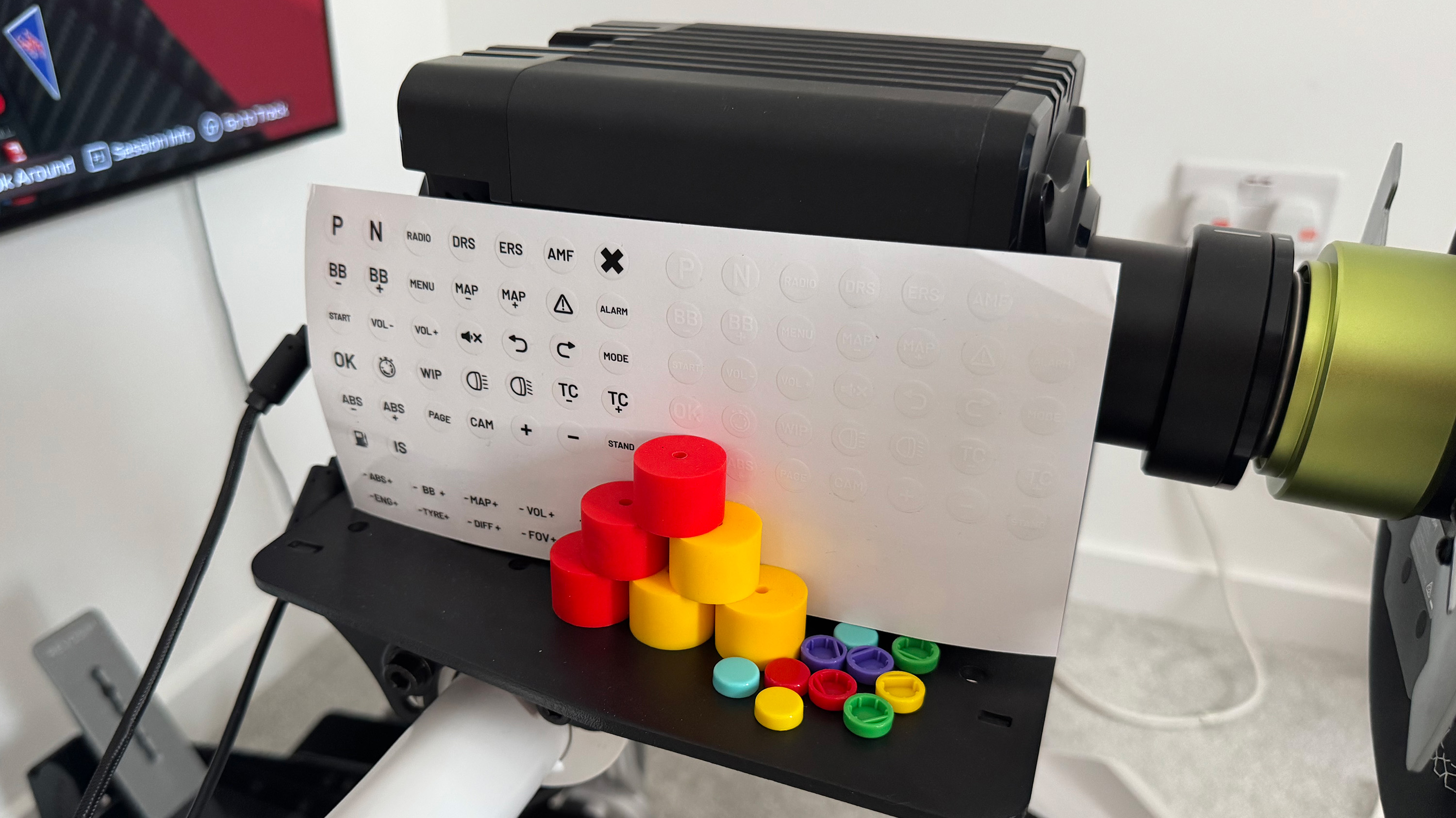 The swappable buttons and stickers of the Nacon Revosim RS Pure bundle