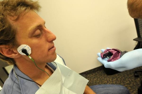 A Spidertech riders gets fitted for his AgilityGuard mouthguard.