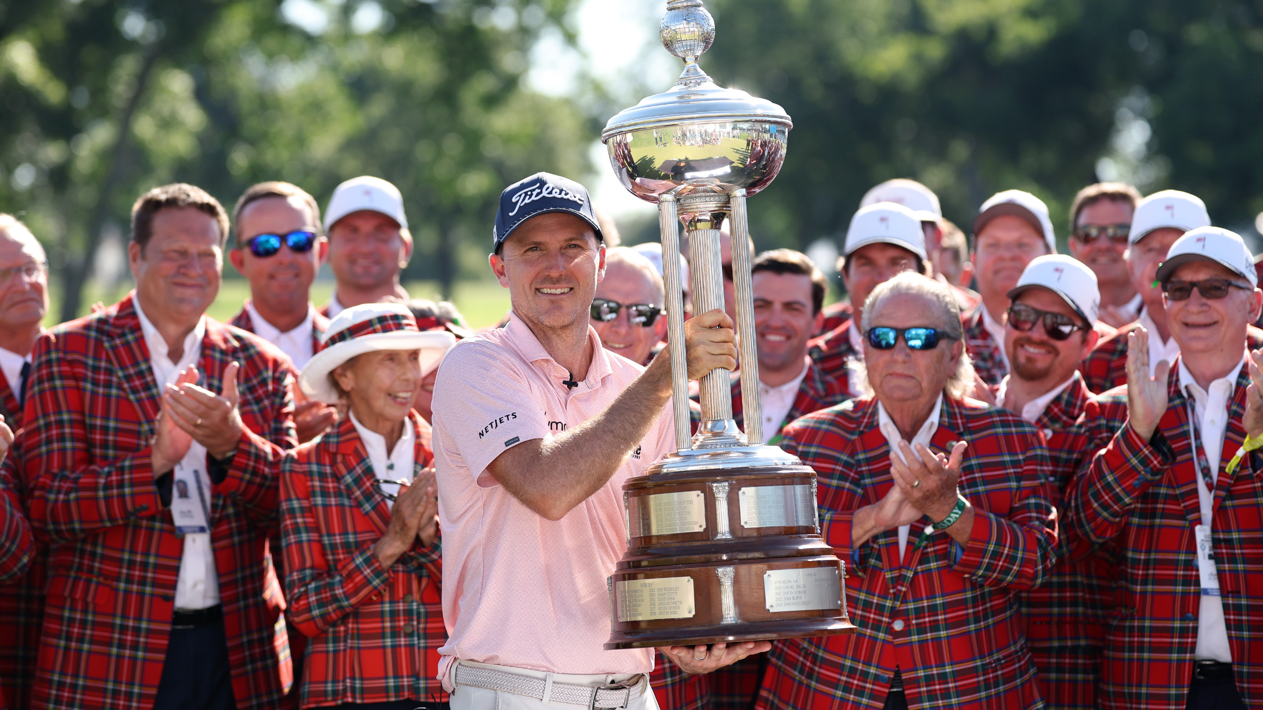 Russell Henley with the Charles Schwab Challenge trophy  