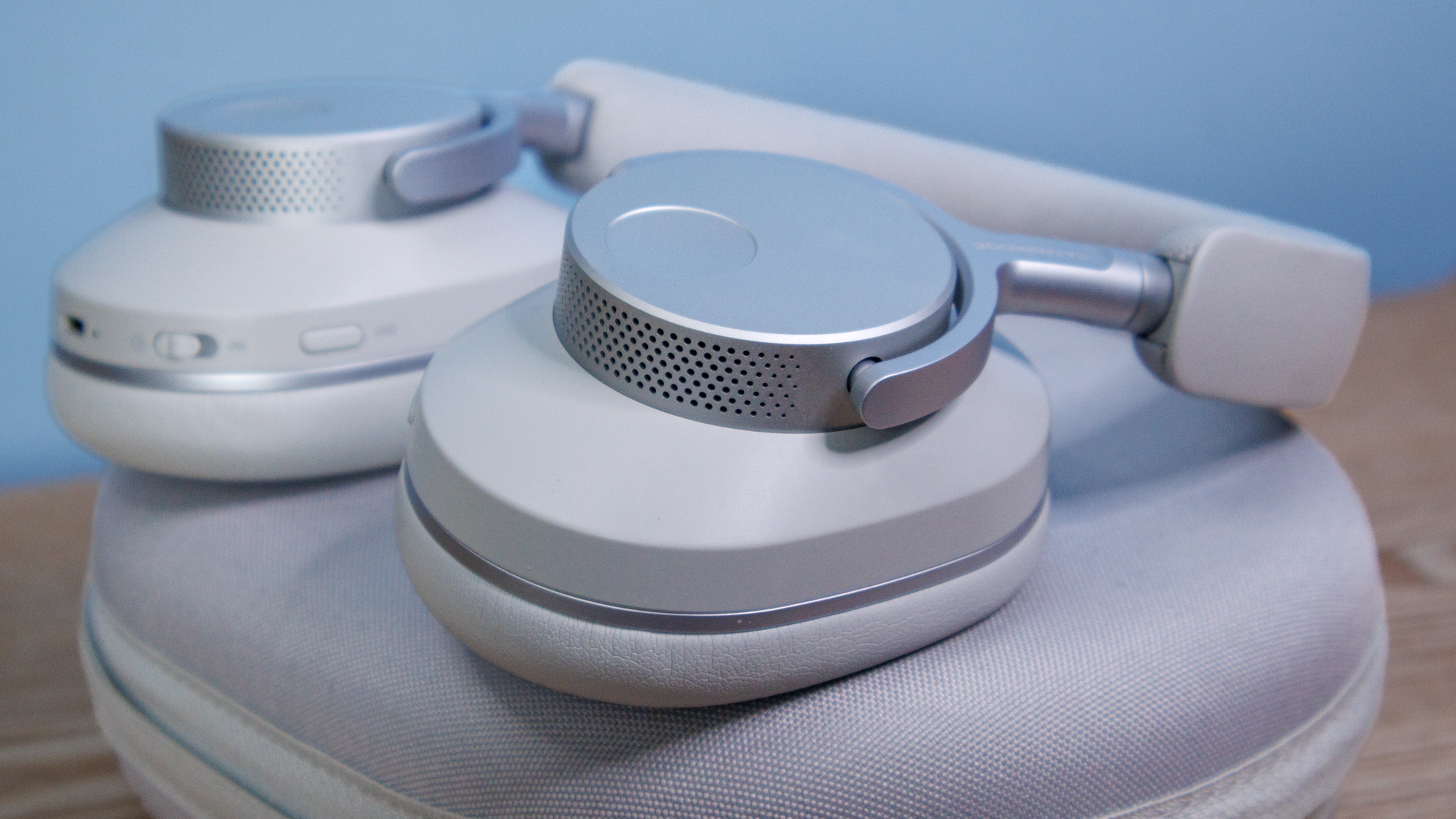 Cambridge Audio Melomania P100 SE headphones and case on a table.
