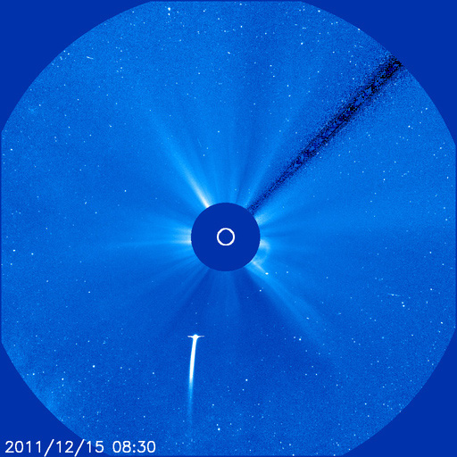 Comet Lovejoy is the bright streak at the bottom of this image, taken by SOHO’s Large Angle Spectrometric Coronagraph (LASCO) C3 instrument. SOHO&#039;s LASCO instrument is a coronagraph. It blocks out the light from the Sun&#039;s disc, creating an artificial ecli