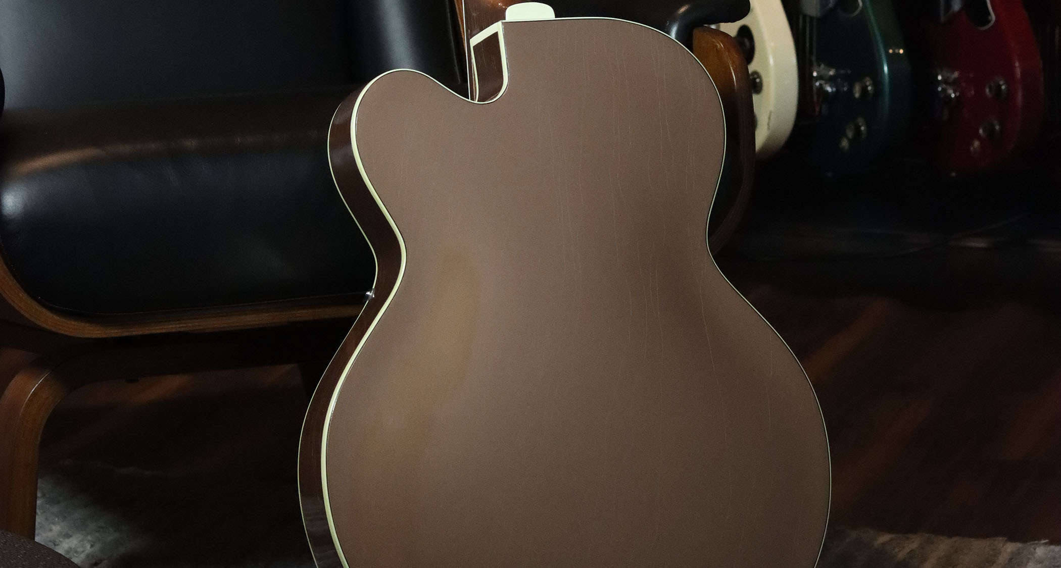 This pristine 1955 Gretsch Streamliner is finished in  Jaguar Tan over Copper Mist and photographed in close-up.