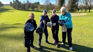 Female golfers with their drivers