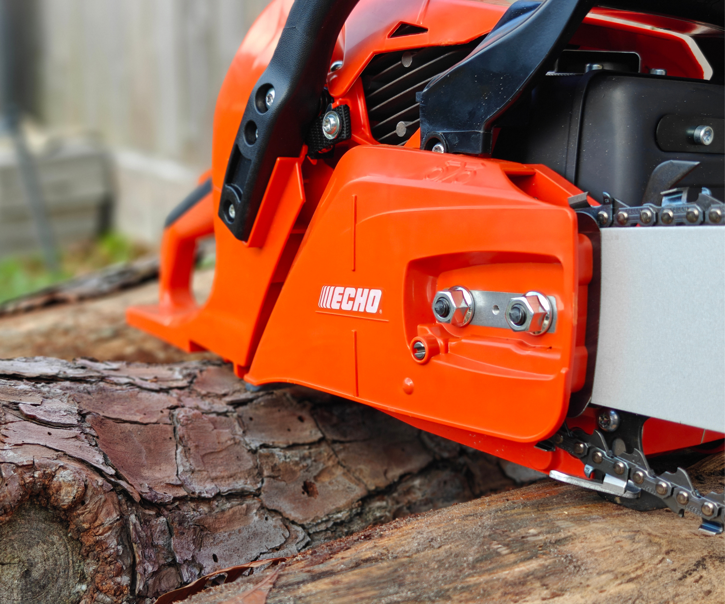 Close up of the bar attached to the motor of the Echo-CS590 chainsaw