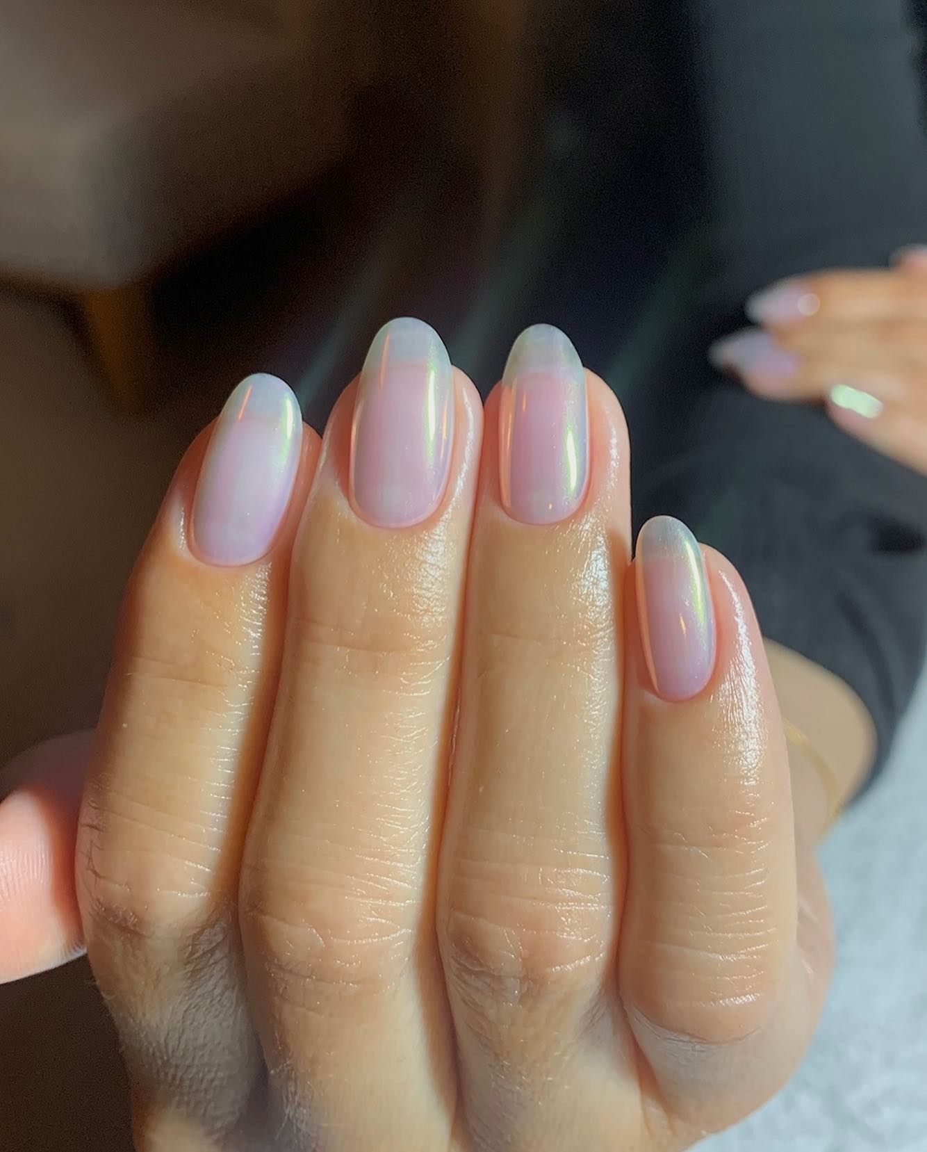 A manicure by @raelondonnails with a sheer chrome powder