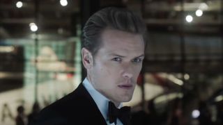 Sam Heughan dressed in a tuxedo and looking serious in The Spy Who Dumped Me.
