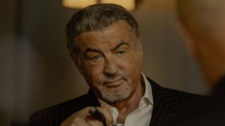 Dwight smoking cigar talking to Dunmire in Tulsa King Season 3