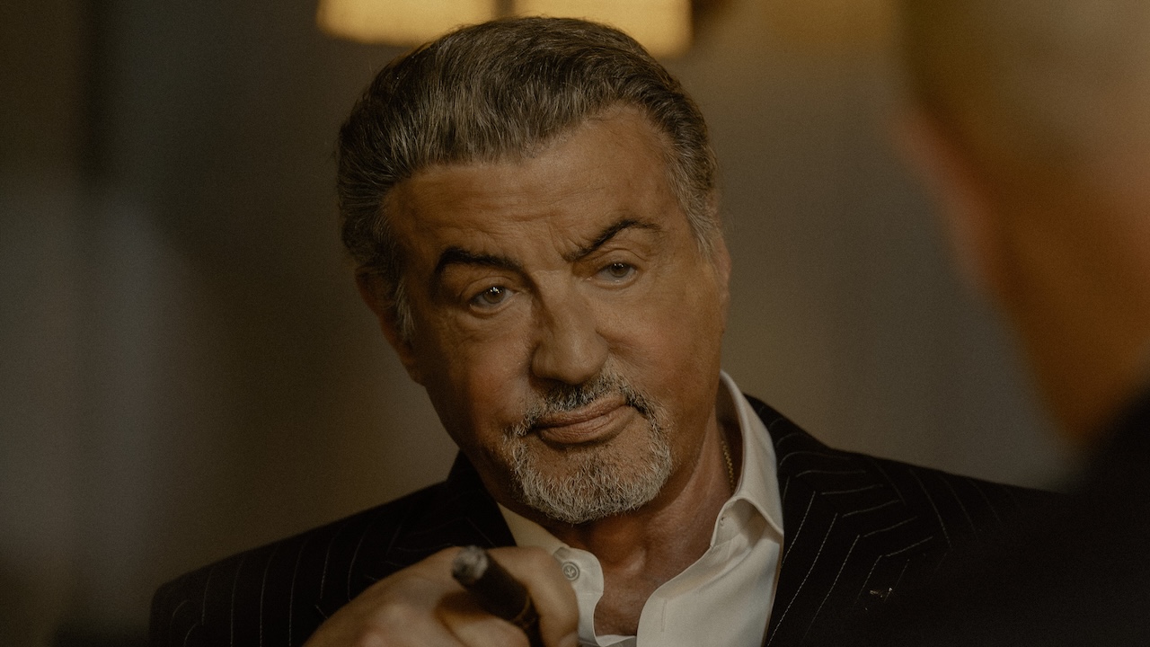 Dwight smoking cigar talking to Dunmire in Tulsa King Season 3