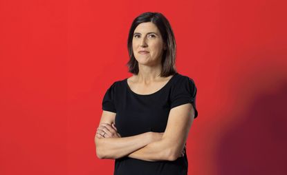 woman in front of red background