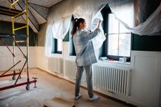Woman making home improvements