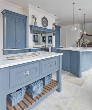 Powder blue kitchen cabinets in kitchen designed by Tom Howley