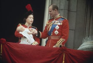 Queen Elizabeth II and Prince Philip with their baby son, Prince Edward on the balcony at Buckingham Palace